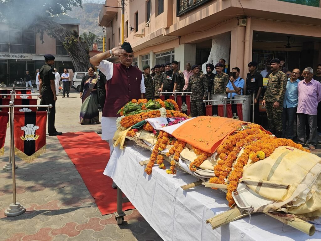 Sainik Welfare Minister Ganesh Joshi paying emotional tribute to Rifleman Sameer Ale by laying a wreath on his mortal remains.