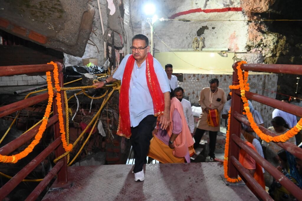Cabinet Minister Ganesh Joshi formally inaugurating the newly constructed bridge at Tapkeshwar Temple, completed within record time.