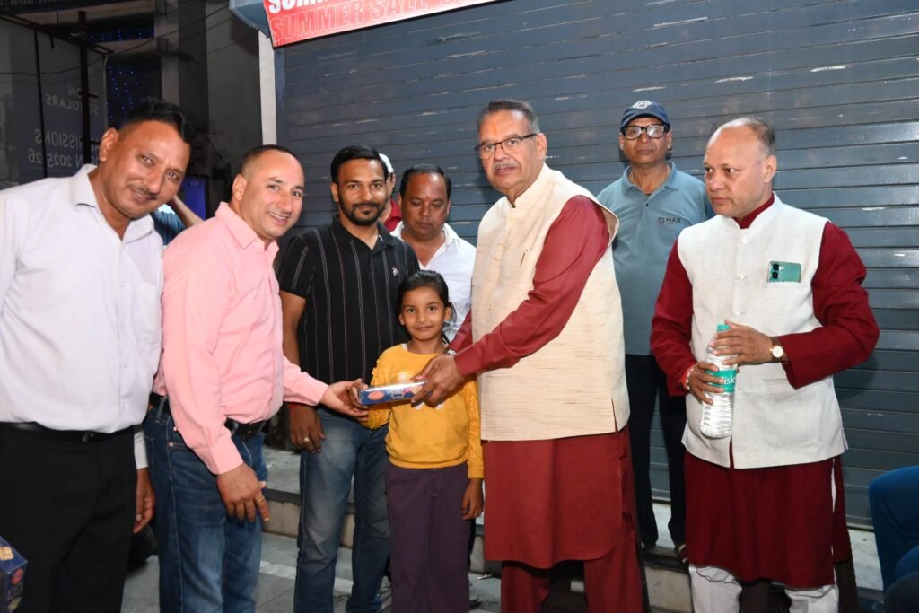 Cabinet Minister Ganesh Joshi meeting shopkeepers in Hathibarkala market and wishing them Happy Diwali